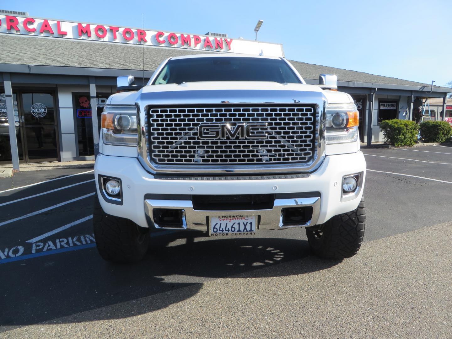 2015 White GMC Sierra 2500 HD Crew Cab Denali (1GT120E88FF) with an V8 Turbo Dsl 6.6L engine, Auto 6-Spd Allison OD transmission, located at 2630 Grass Valley Highway, Auburn, CA, 95603, (530) 508-5100, 38.937893, -121.095482 - 2015 GMC Denali 2500 6.6L Duramax Diesel. Cognito 4-6" lift kit, Cognito traction bars, Cognito idler and pitman support, Kryptonite upper control arms, Fox remote reservoir shocks, Amp power steps, Fuel Offroad wheels, Nitto Ridge Grappler tires, Alpine Stereo Firestone ride rite air bags, Transfer - Photo#1